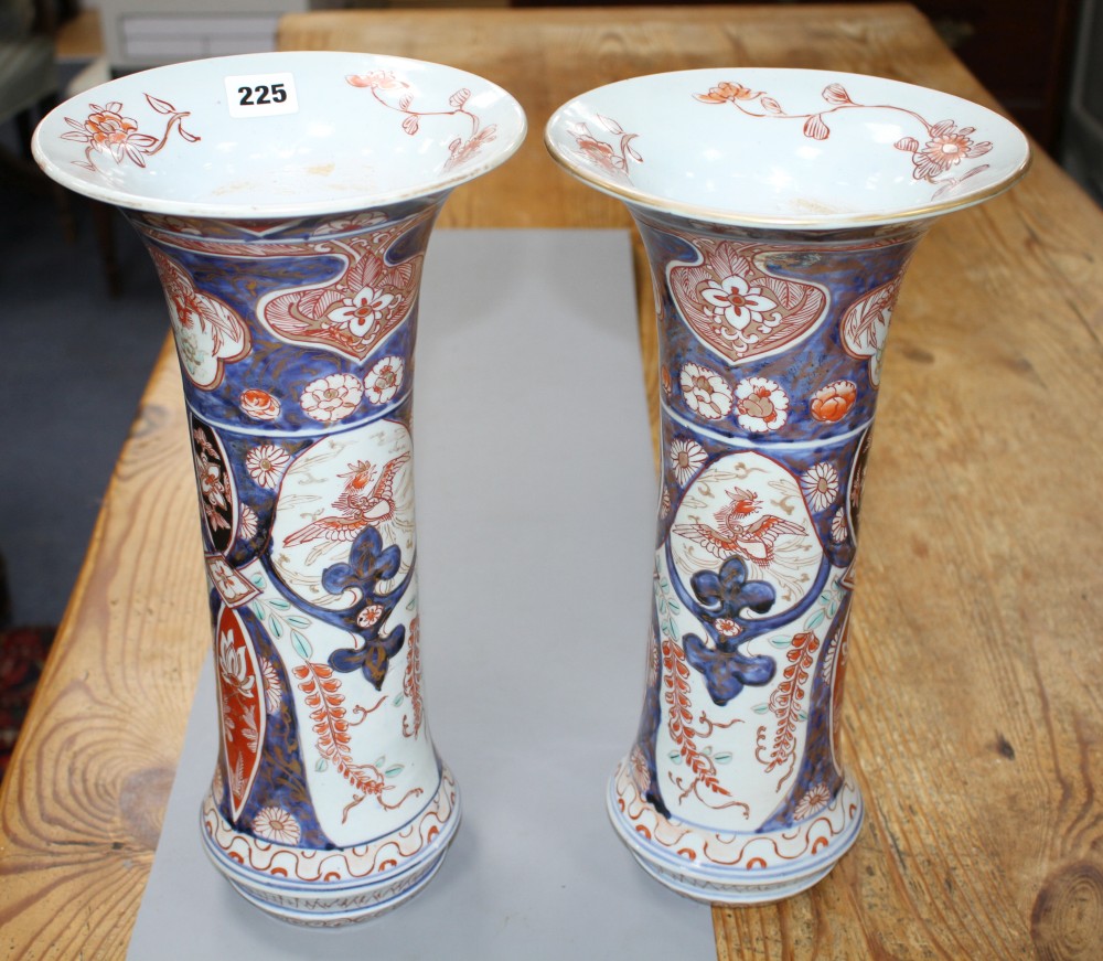 A near pair of Imari trumpet vases, decorated with birds and flowers, height 39.5cm